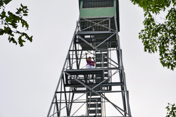 Karen Duquette climbing the Aiton Heights Fire Tower